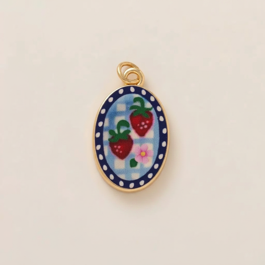 Strawberry enamel charm - cream background