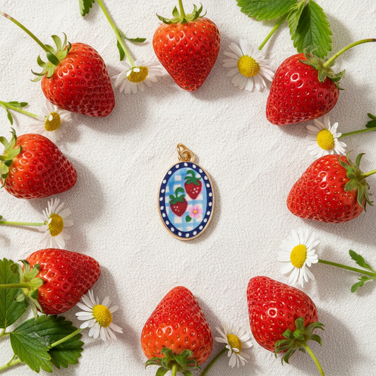 Strawberry enamel charm - linen flat lay